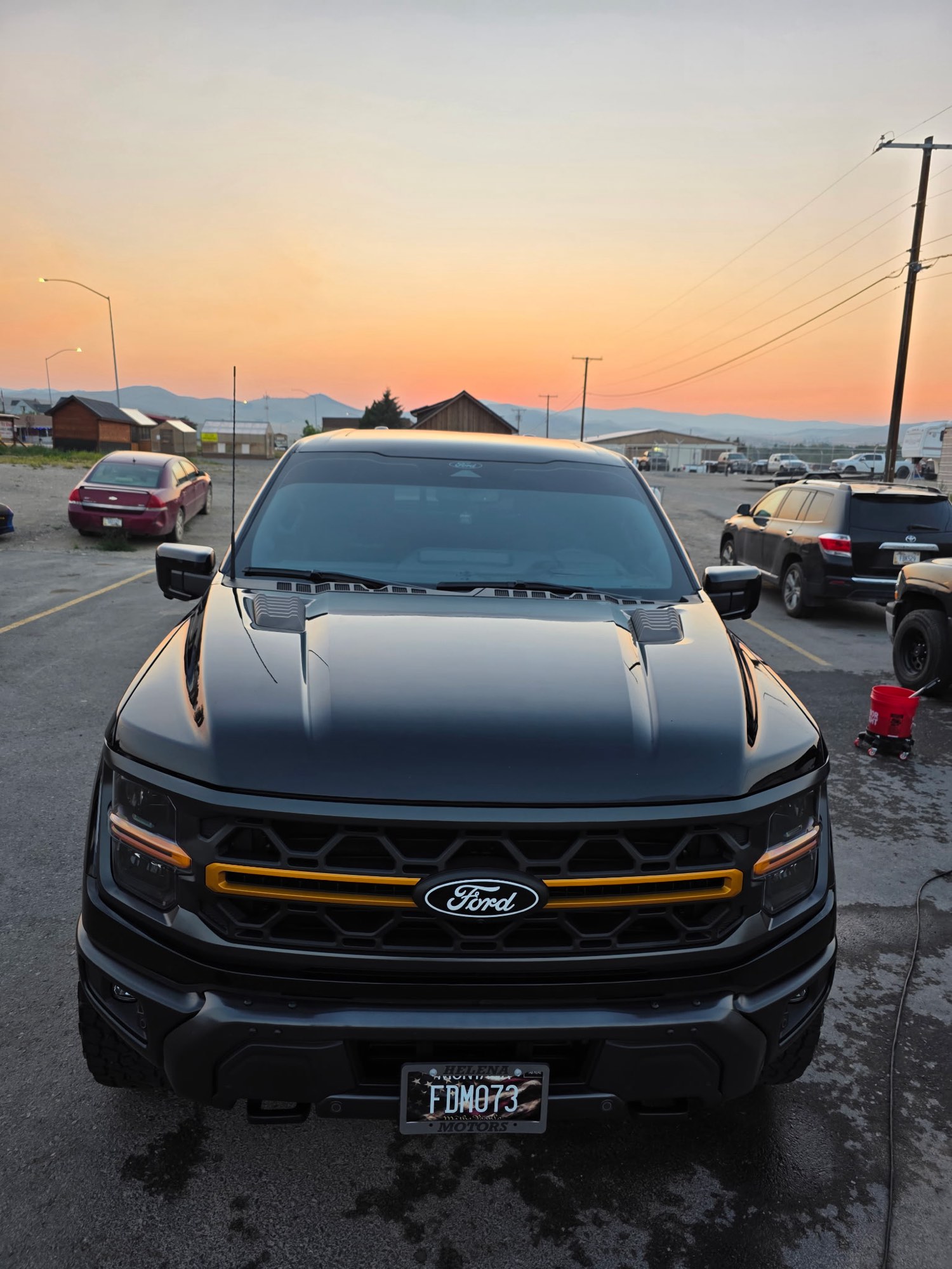 Black Ford F-150 detailed by Velocity Racing, photographed at sunset