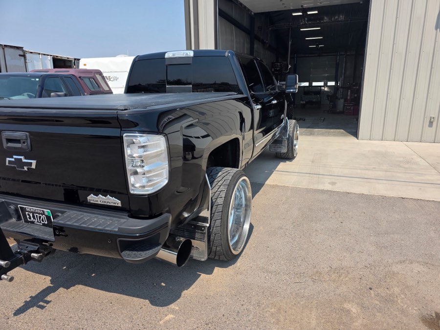 Rear three-quarter of a detailed black Silverado