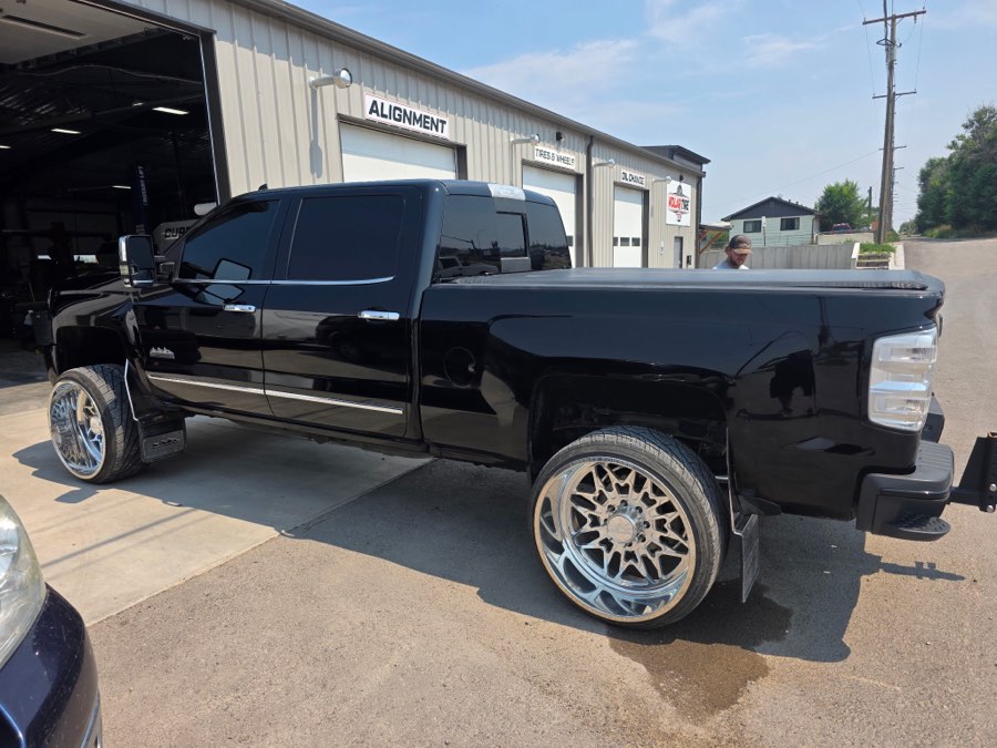 Side profile of a detailed lifted black truck