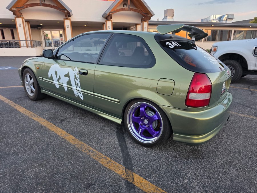 Green Honda Civic hatchback after detailing