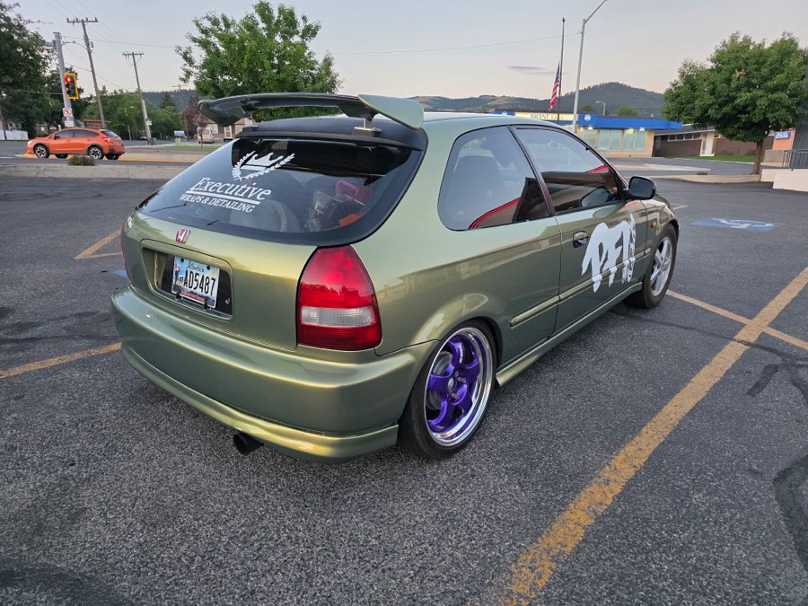 Rear of a detailed green Honda Civic hatchback