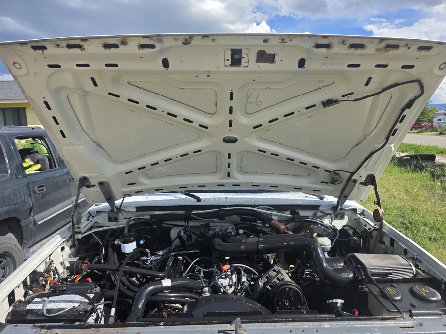 Cleaned engine bay of a work truck, hood open