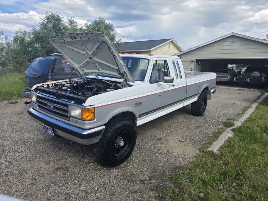 Work truck with the hood up during an engine bay clean