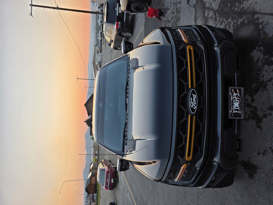 Detailed black Ford truck photographed in the evening