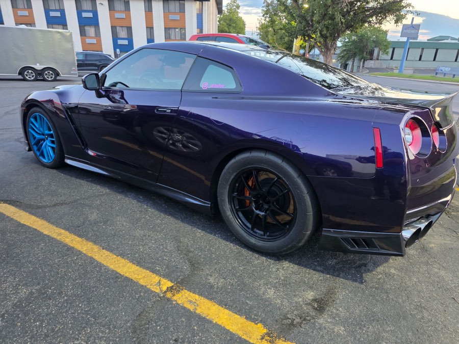 Rear three-quarter of a detailed purple Nissan GT-R
