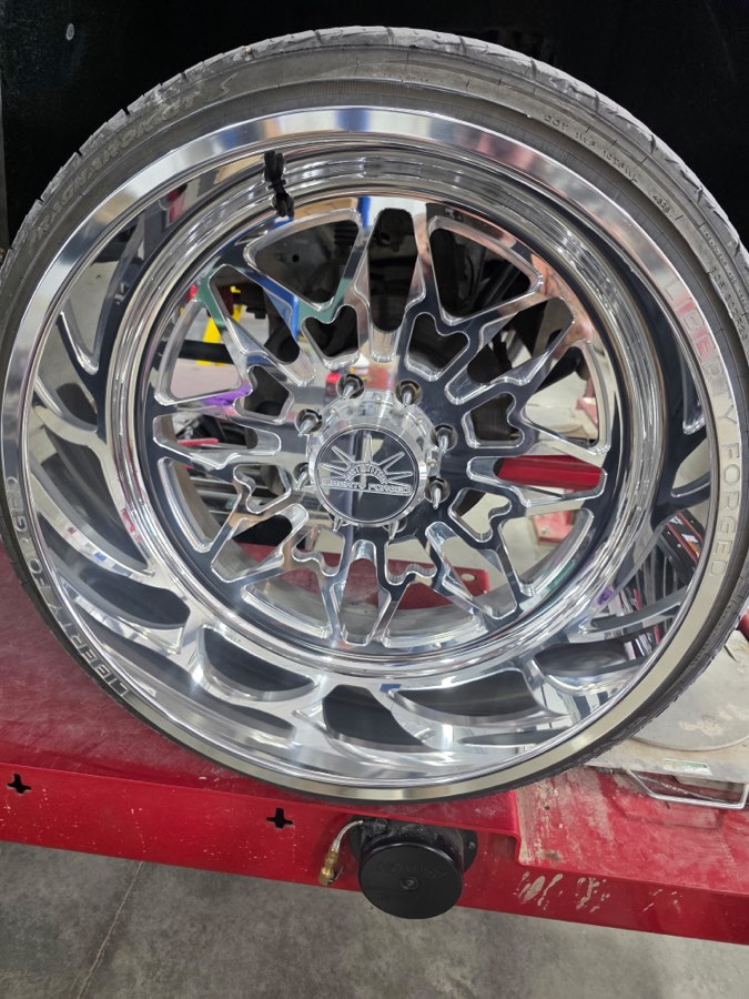 Polished forged wheel and dressed tire after cleaning
