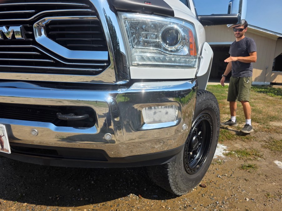Cleaned grille and headlight assembly on a Ram truck