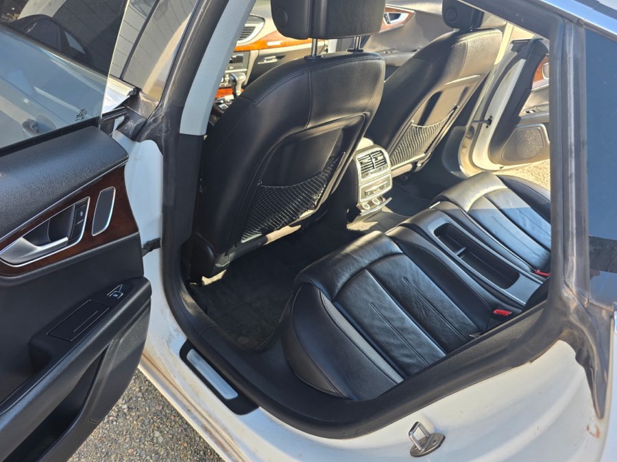 Cleaned front seats and door panel of a silver sedan