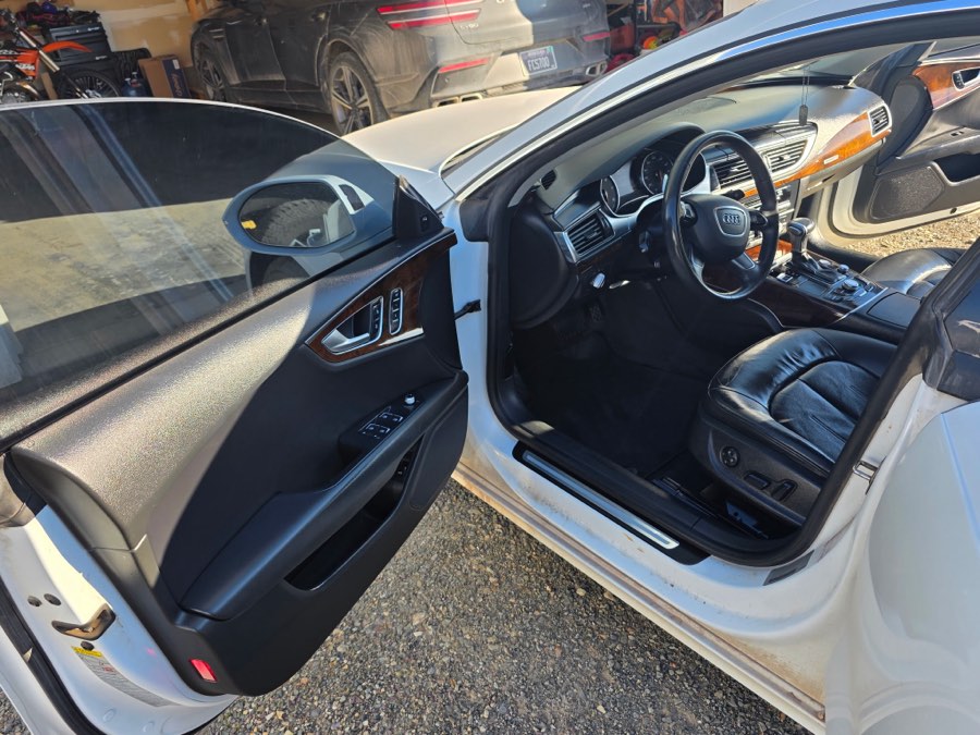 Detailed interior and door jambs of a silver sedan