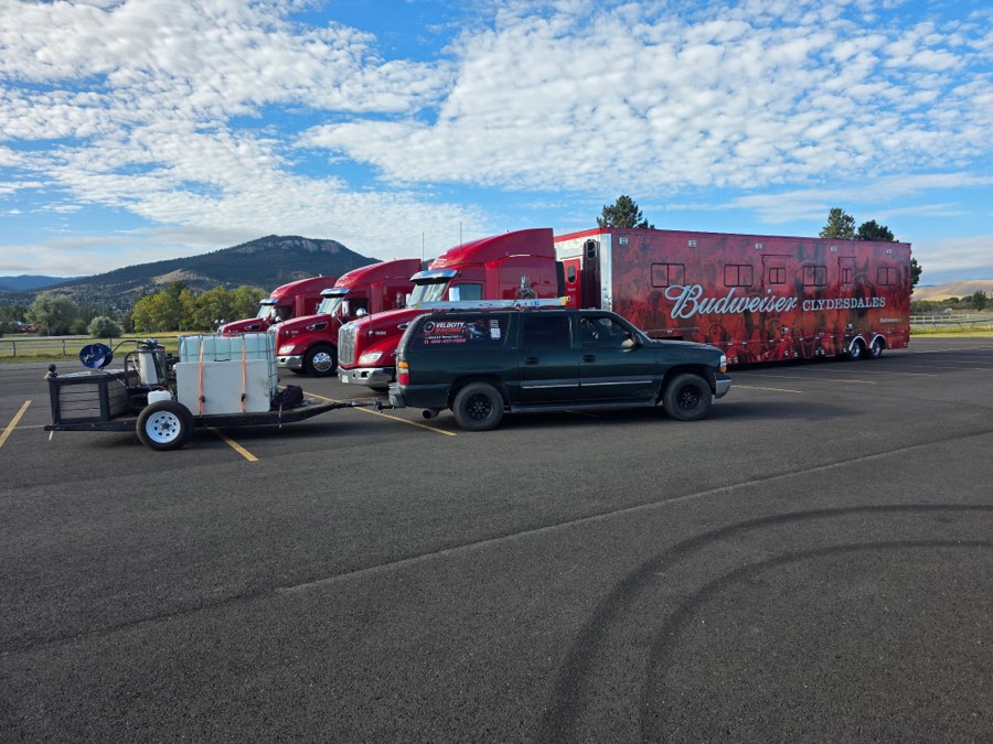 Velocity Racing mobile wash rig parked alongside the Budweiser Clydesdales semi trucks and trailer