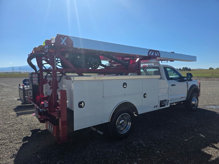 Rear quarter of a pump-hoist service truck after a full exterior detail